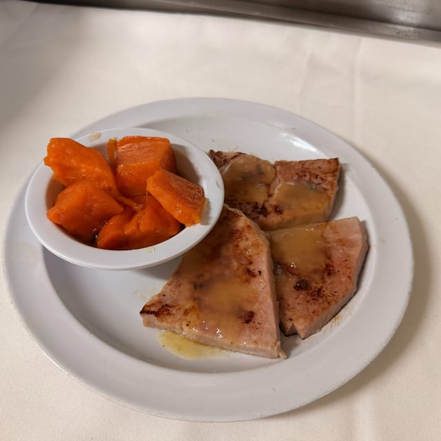 Baked Ham with Pineapple Sauce and Sweet Potatoes.